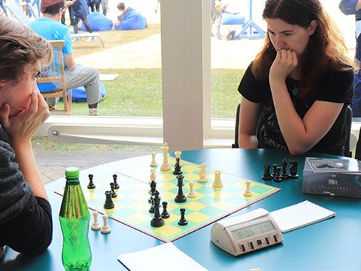 Two people playing chess at Chess Club UCOL