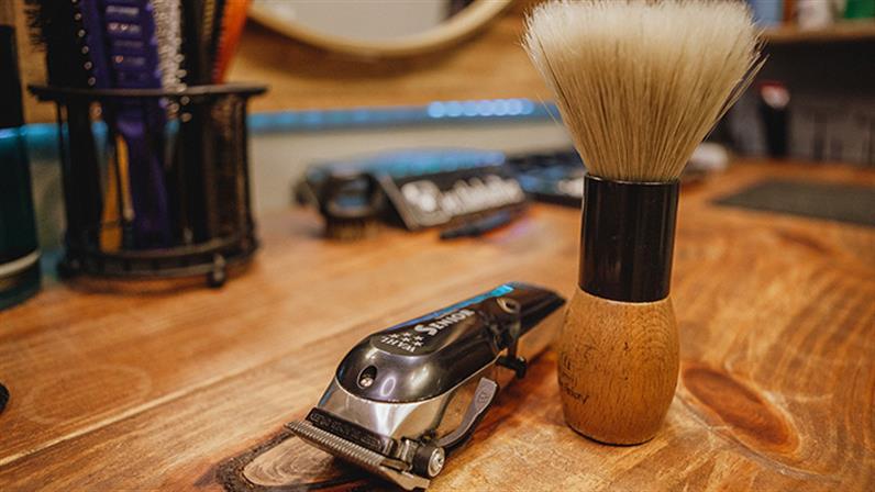 Close-up of clippers and shaving brush