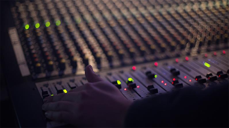 Close up of a mixing desk in a recording studio.