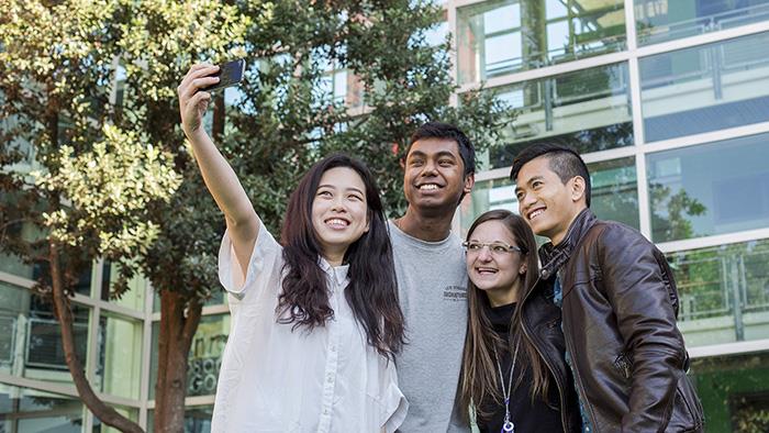 A group of international students taking a selfie at UCOL