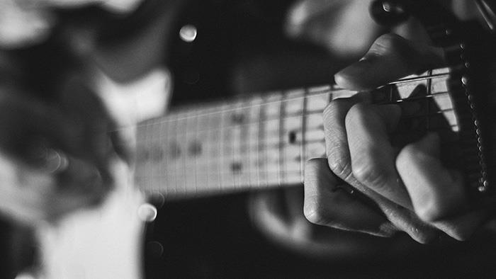 A close-up image of a guitar