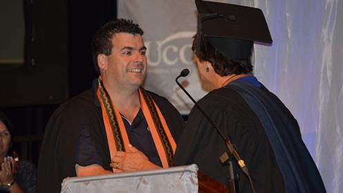 A student being presented with an honours award