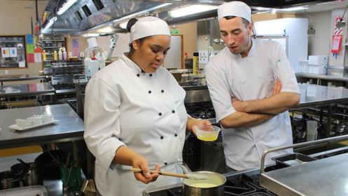 Chef Training and Hospitality students in kitchen