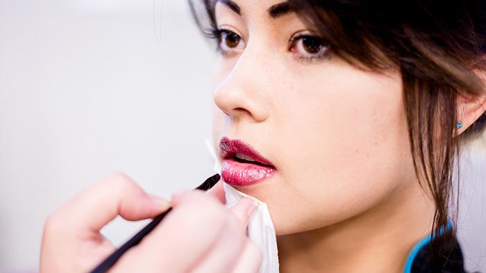 Lipstick application in UCOL's Beauty facilities