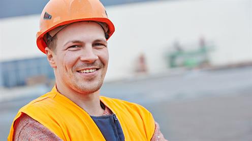A photograph of a construction worker wearing a hard hat