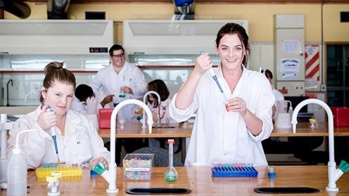 A photograph of students conducting experiments in a UCOL science lab