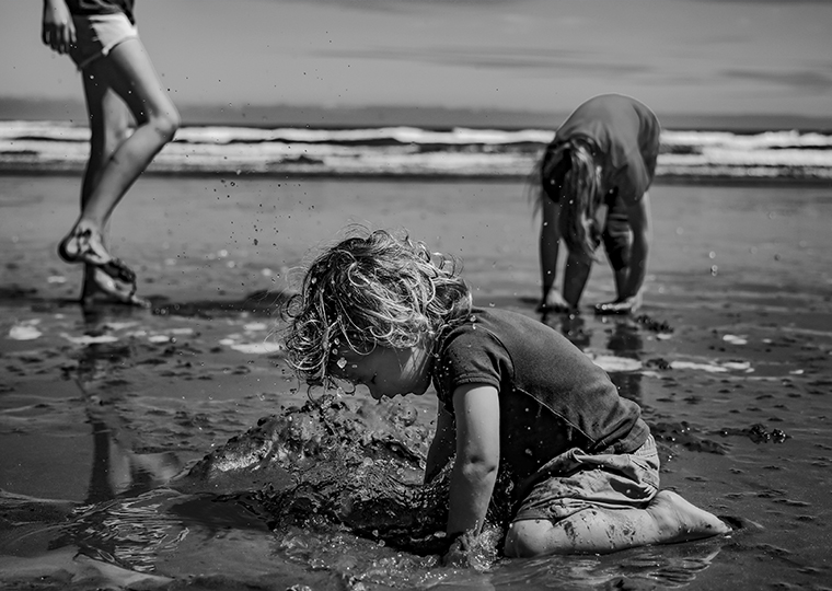 Child playing at the beach
