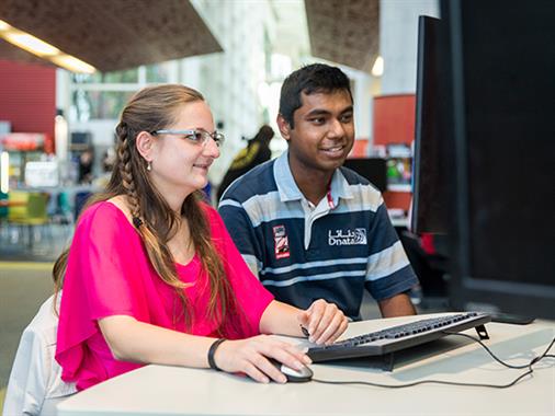 International students work together on the computer pods in the Palmerston North atrium