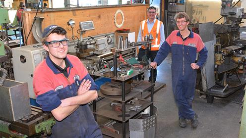 From left Reagan Shaw, Dave Hoskins (owner of AEC), and Lachlan Harrigan in the workshop.