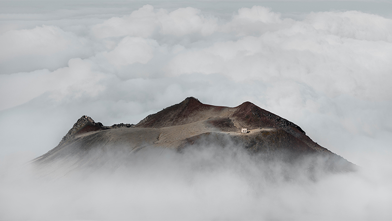 Mountain peak shrouded in clouds
