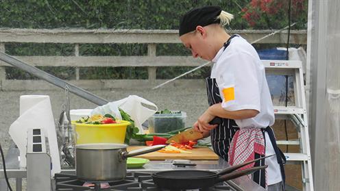A photograph of UCOL Chef Training student Chavelle Hanger competing in the Woodhaven Gardens Cooking Competition.
