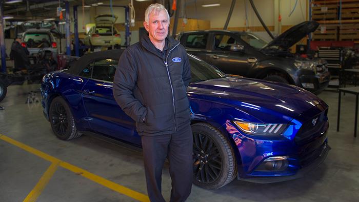 Ford Technical Trainer Don Rubie with the prototype Ford Mustang.