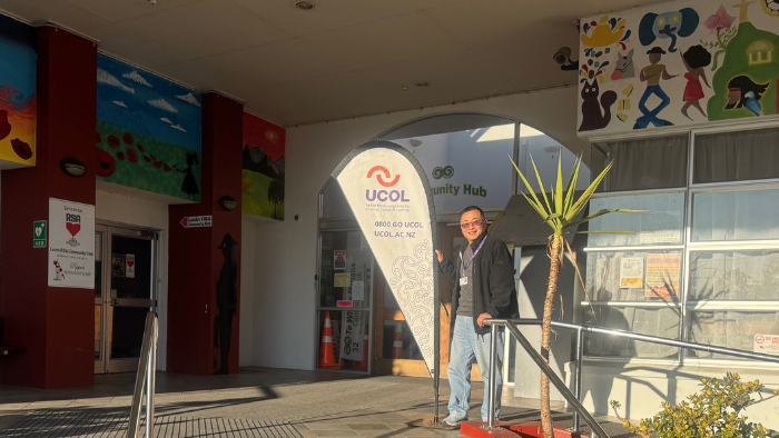 Kevin Qin stands outside Te Whare Mahana