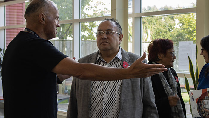 MP Adrian Rurawhe talking to a UCOL staff member