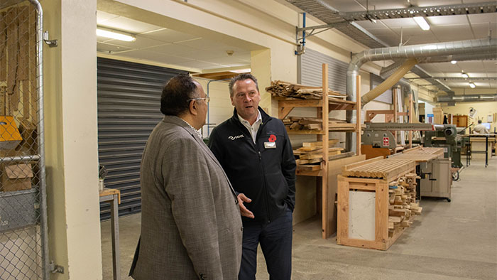 MP Adrian Rurawhe talking to a UCOL staff member in the UCOL woodwork workshop