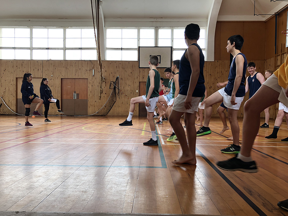 Students following exercise instructors