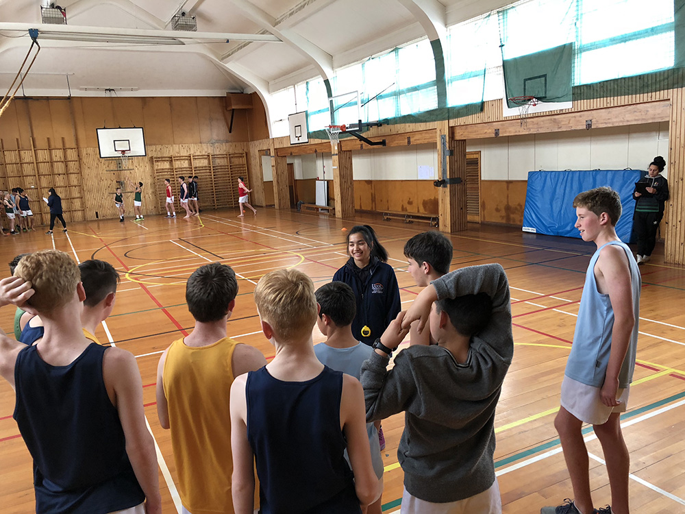 Students talking in indoor court