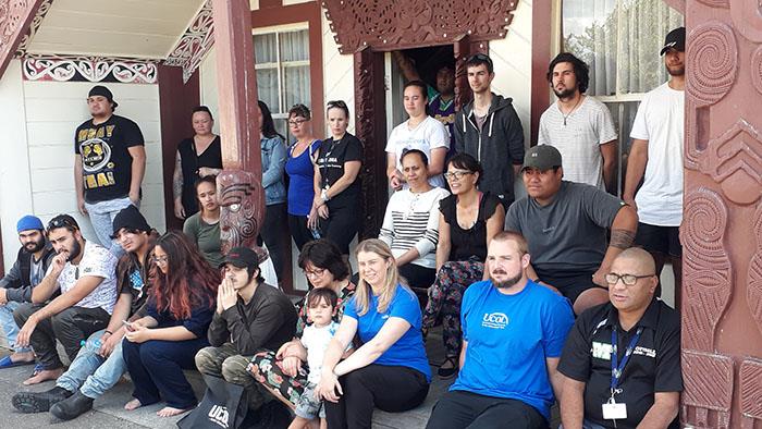 A photograph of a group of people at a Marae for a UCOL hui