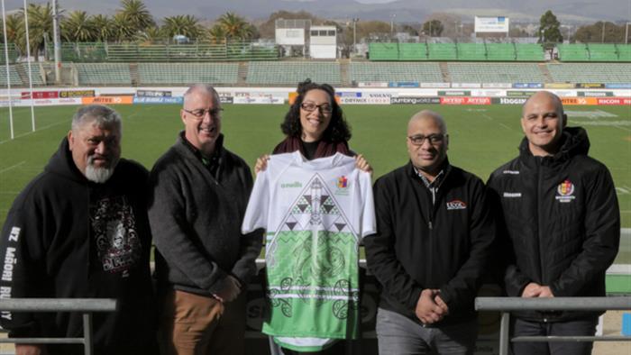 Heneriata Te Whata holding the rugby jersey she designed Heneriata Te Whata holding the rugby jersey she designed