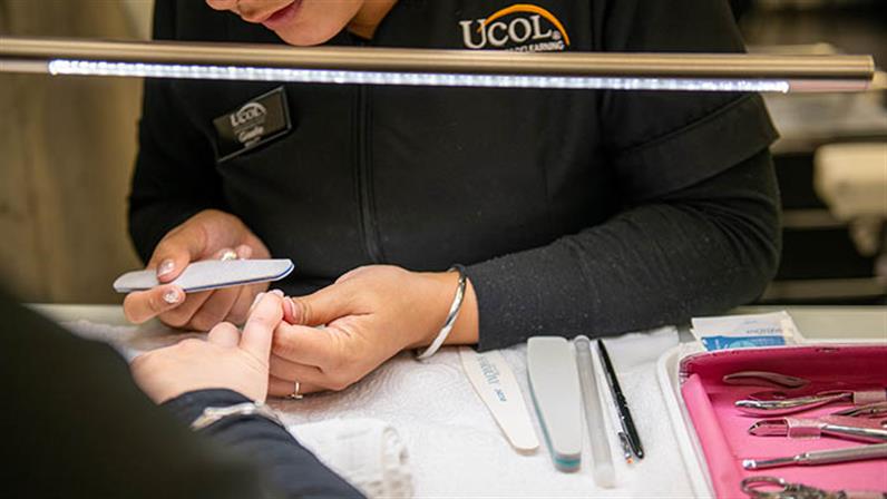 UCOL students working on nails
