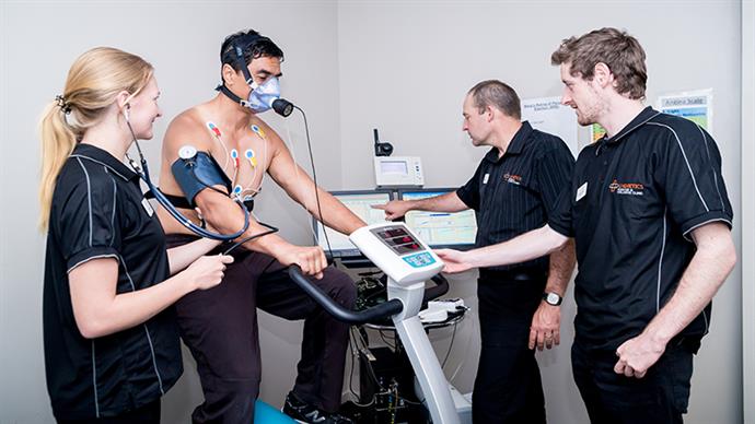 Students performing a V02 Max test with a person.