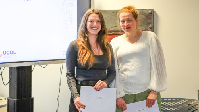 Jessie Howell and Julia Batyrova receive their scholarships