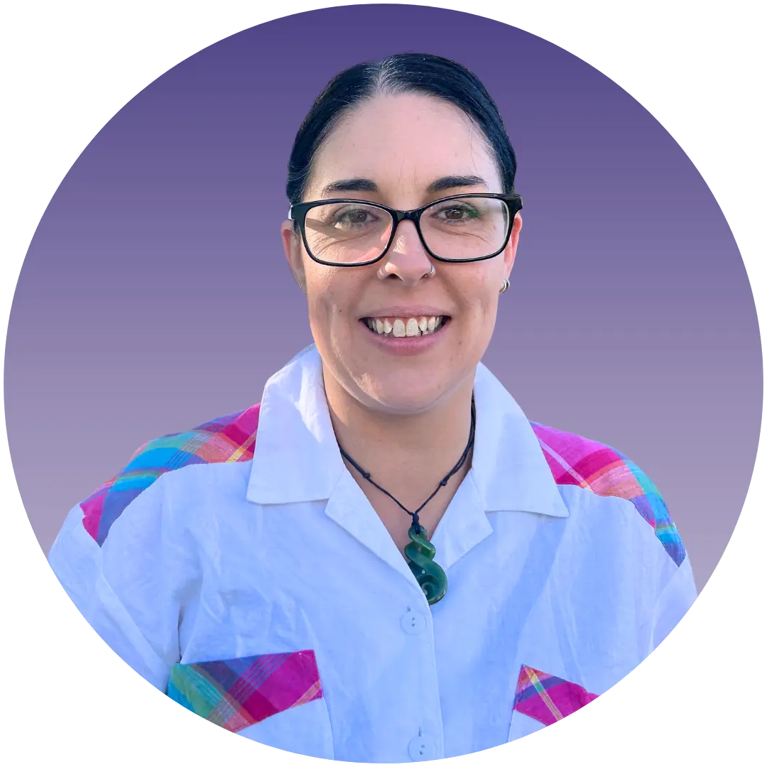 a woman wearing glasses and a white shirt