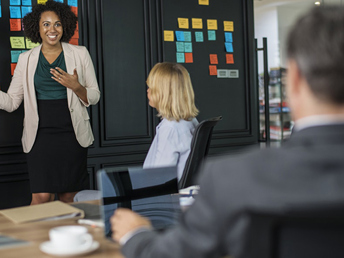 A lady doing a presentation in a corporate environment