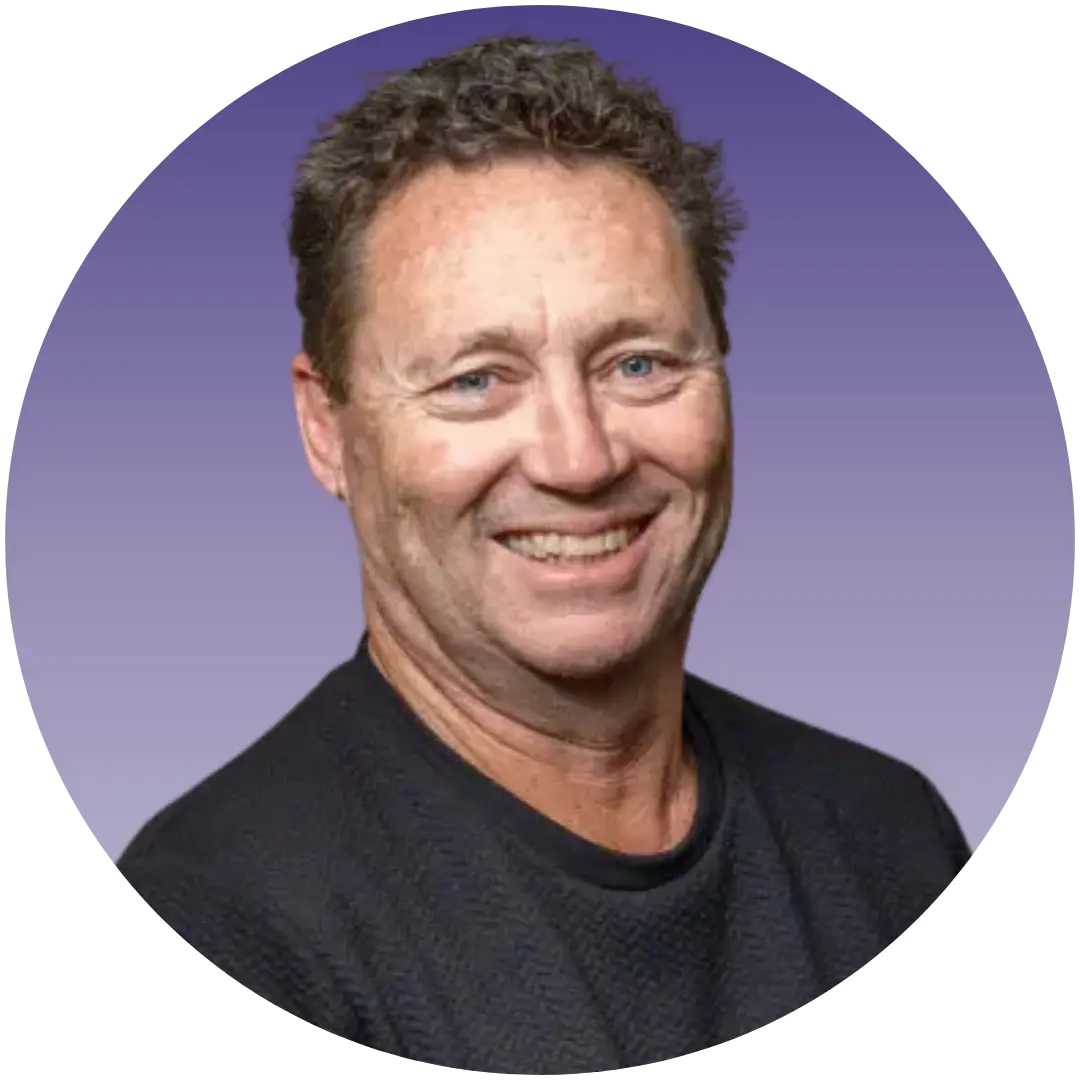 a man smiling at the camera