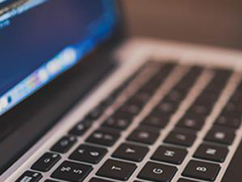 A laptop showing half of the screen and the keyboard