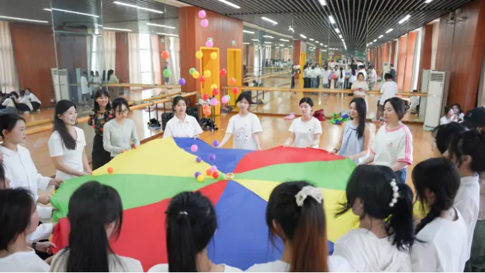 a group of people in a room with a large umbrella