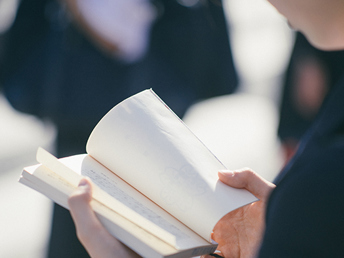 A close-up of a person reading a book