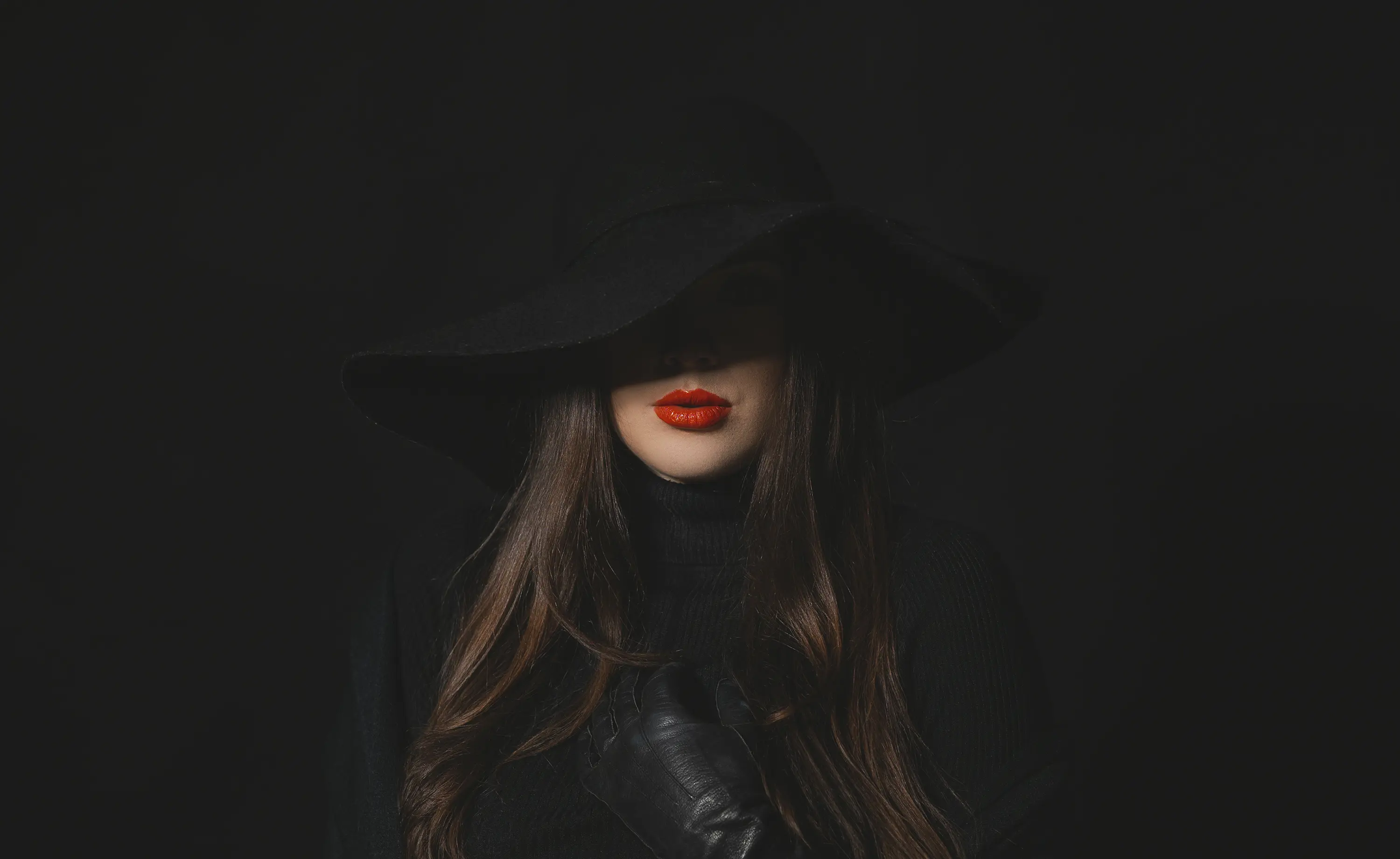 a woman wearing a hat and gloves