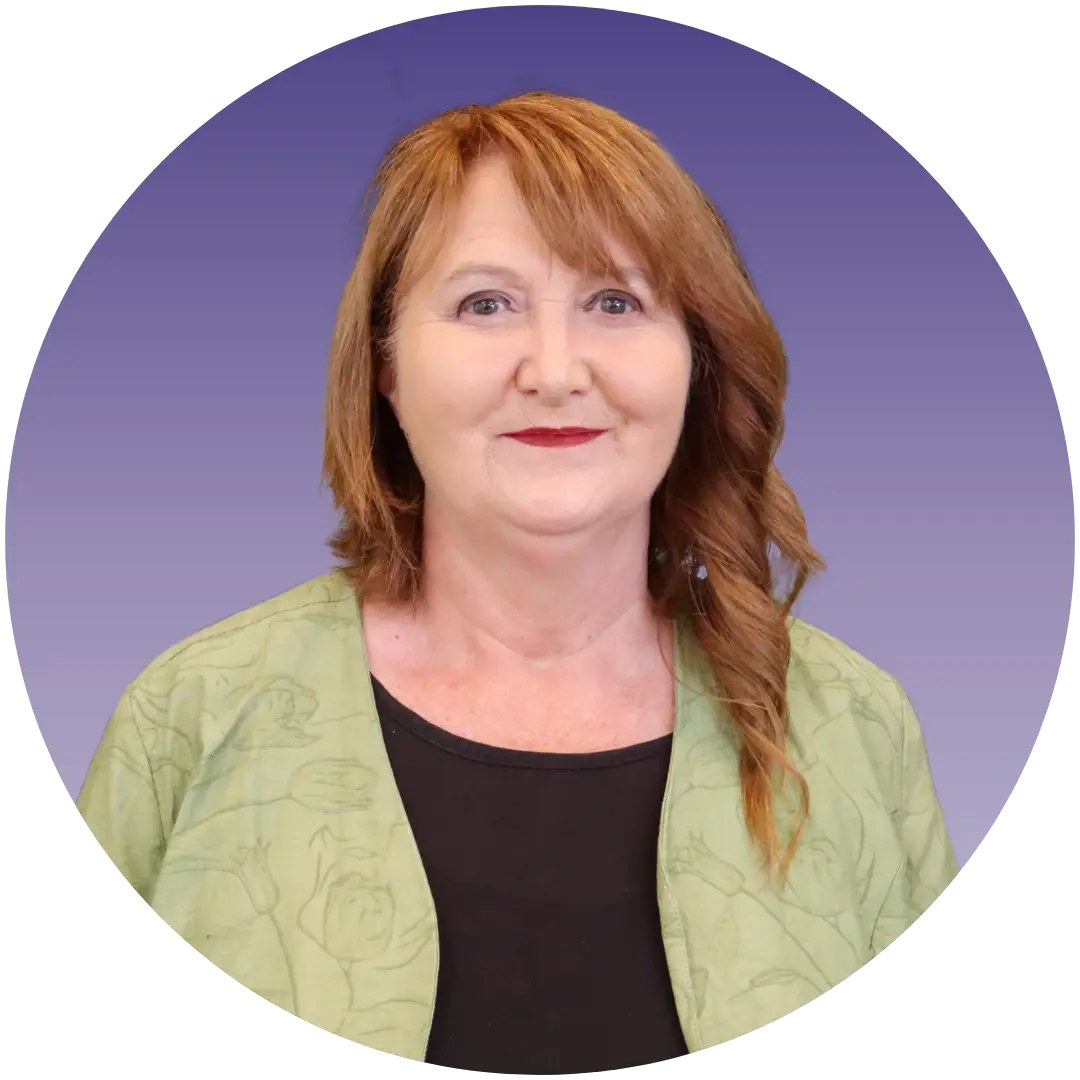 a woman with red hair and a green jacket