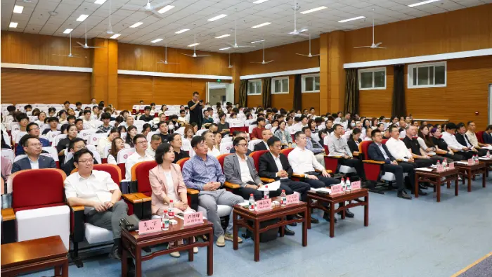 a group of people in a lecture hall