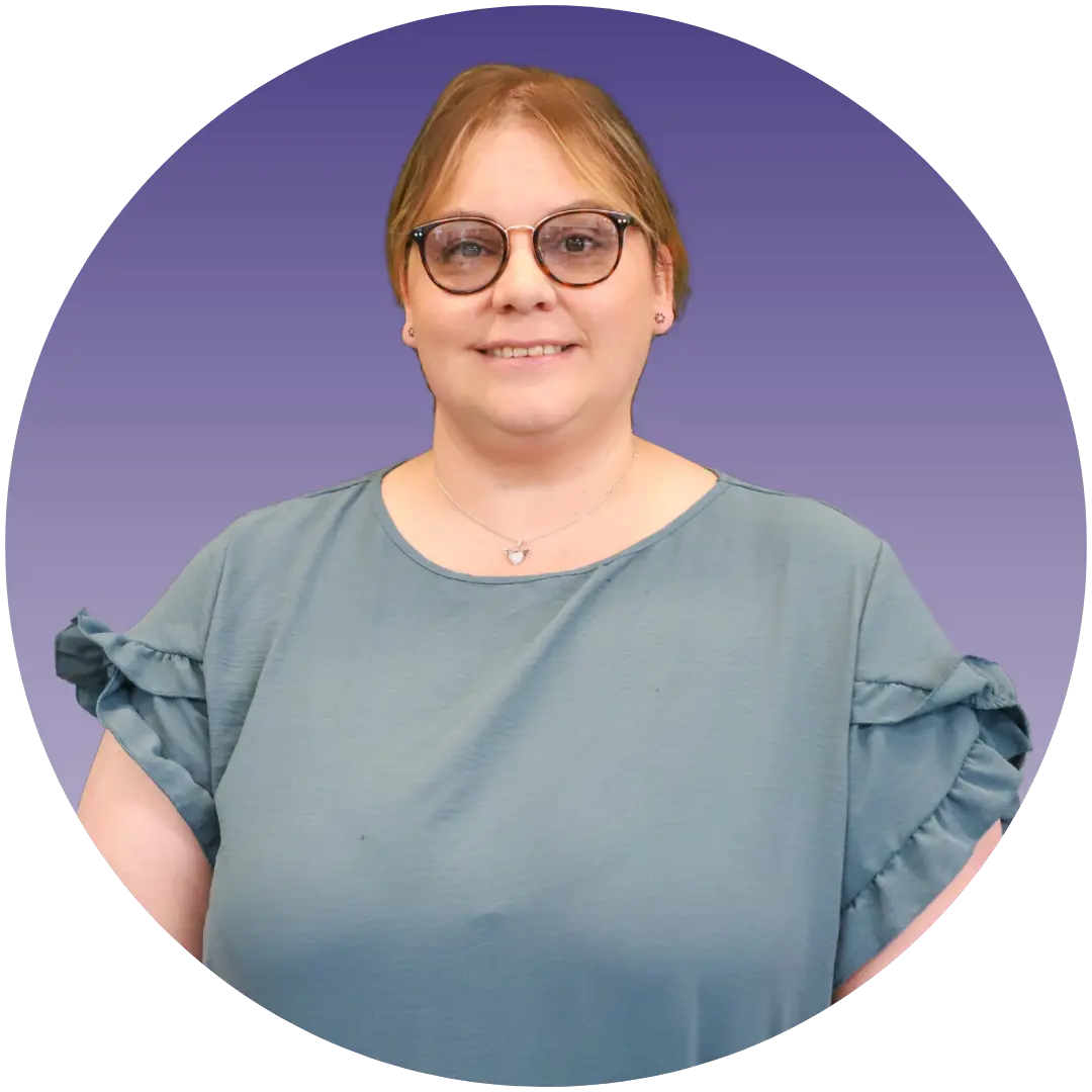 a woman wearing glasses and a blue shirt