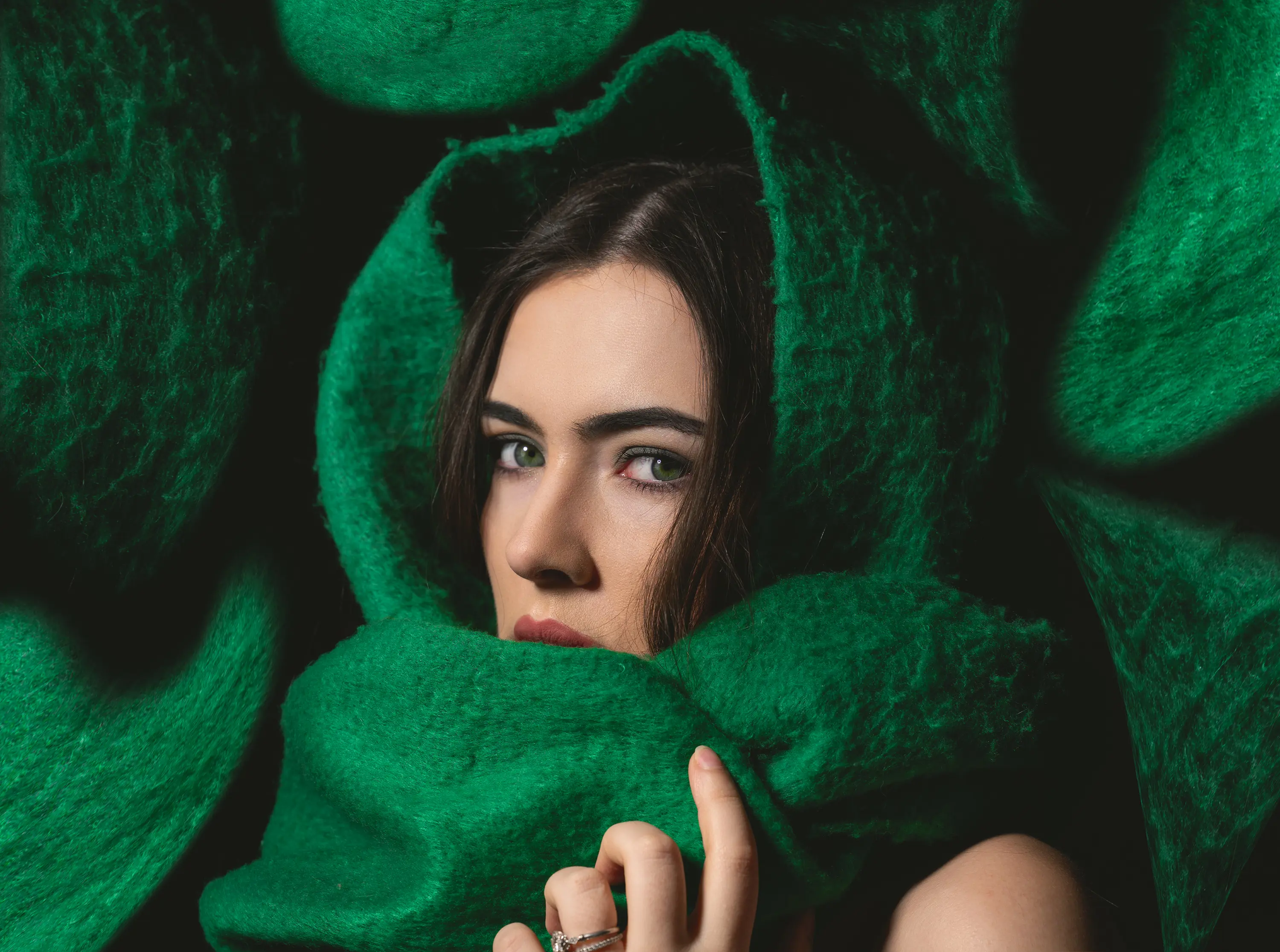 a woman with a green scarf around her head