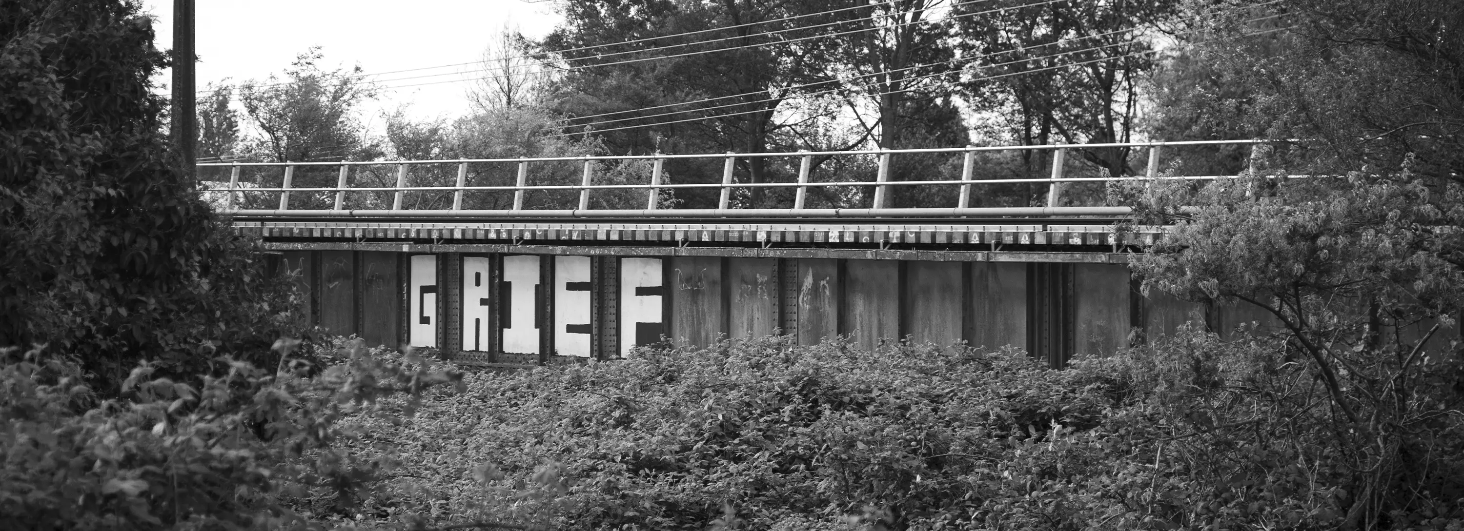 a train track with a fence