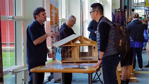 A person talking to an exhibitor at UCOL Open Day 2018 A person talking to an exhibitor at UCOL Open Day 2018